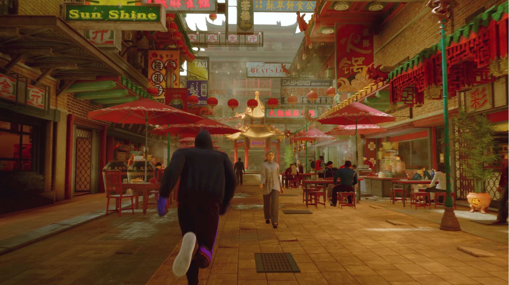 Um jogador corre por um bairro chinês no Street Fighter 6 World Tour.