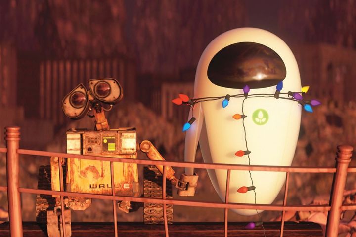 WALL∙E and an inactive EVE holds hands in a scene from the Pixar film Up