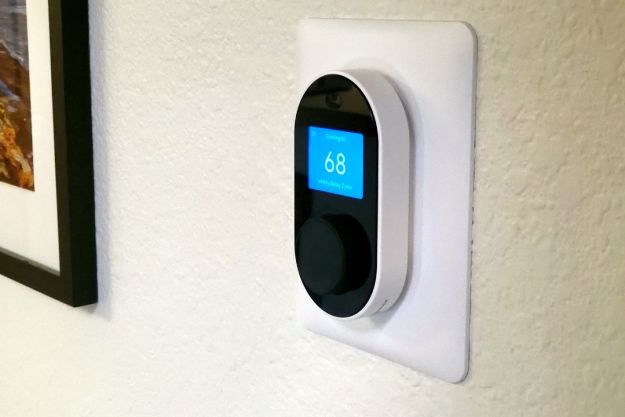 Wyze Thermostat installed on a white wall.