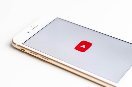 YouTube logo on phone screen