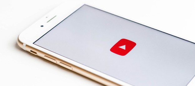 The red and white YouTube logo on a phone screen. The phone is on a white background.