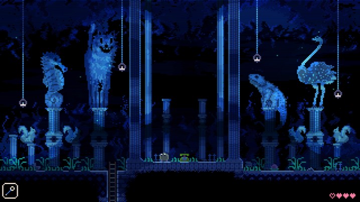 A creature sits in a blue room in Animal Well.