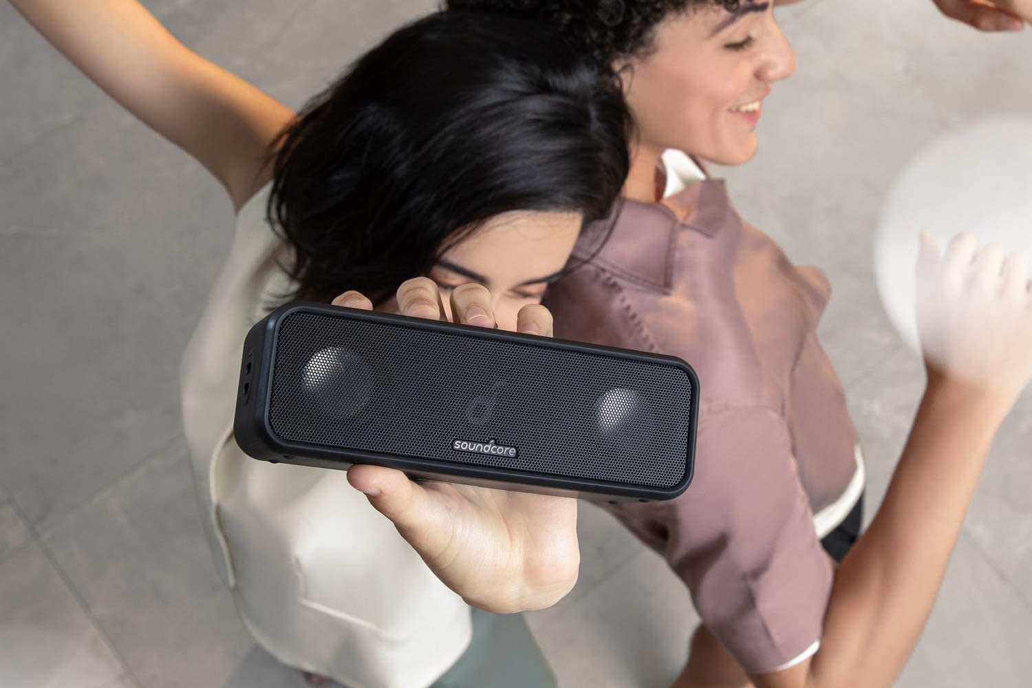 Two dancers using the Anker Soundcore 3.