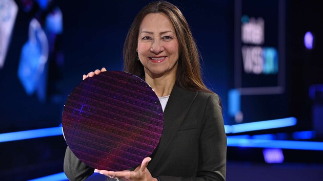 Sandra Rivera smiles as she holds an Intel Sapphire Rapids wafer.