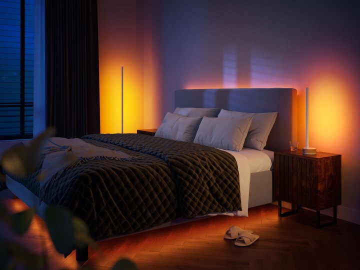 Philips Hue Signe lamps with oak finish set up in bedroom.