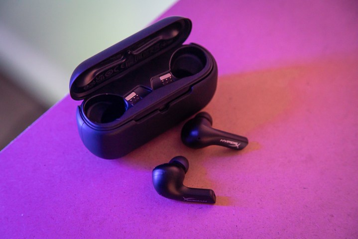 HyperX Cloud Alpha earbuds sitting outside of their case.