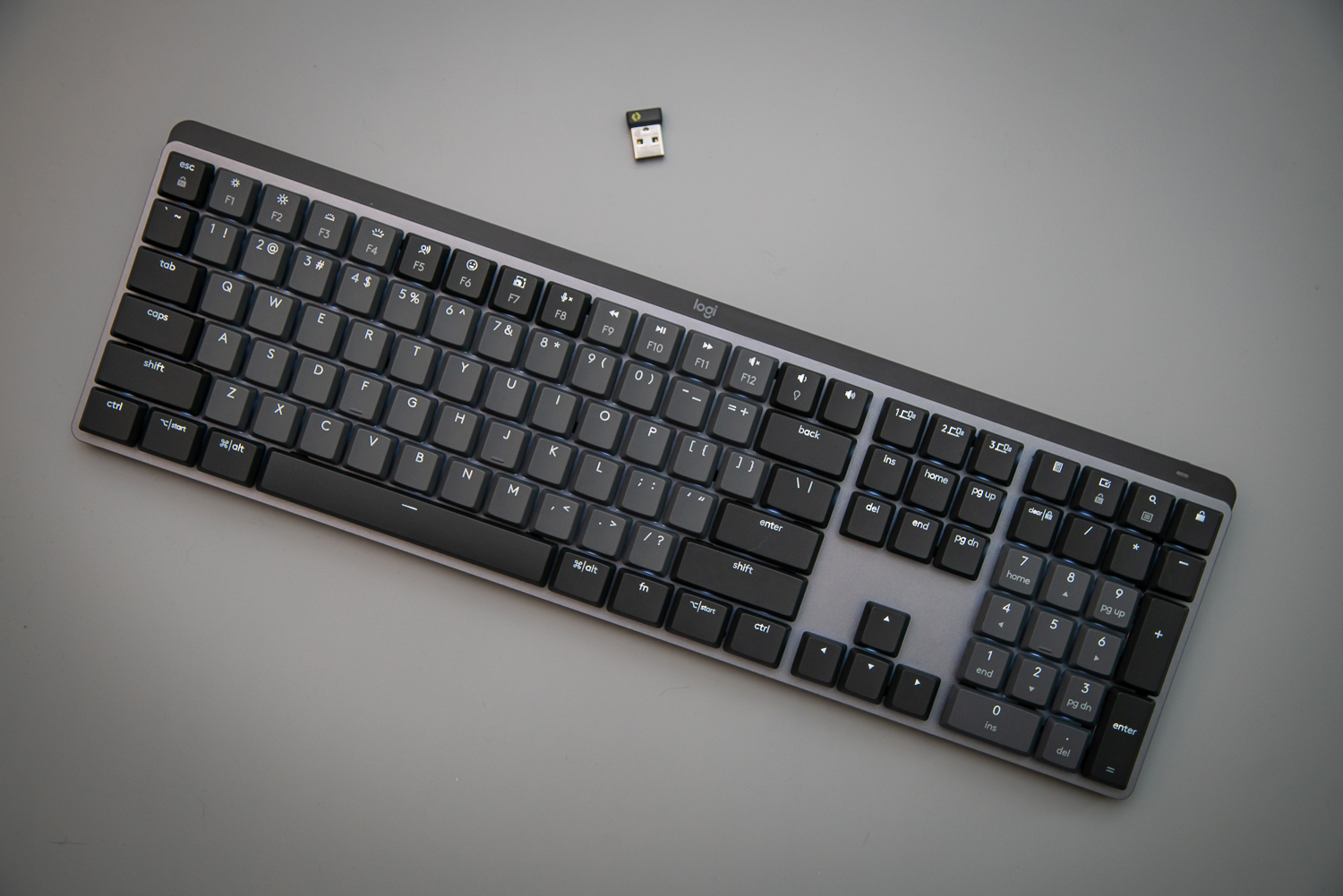 Logitech MX Mechanical keyboard on a gray background.