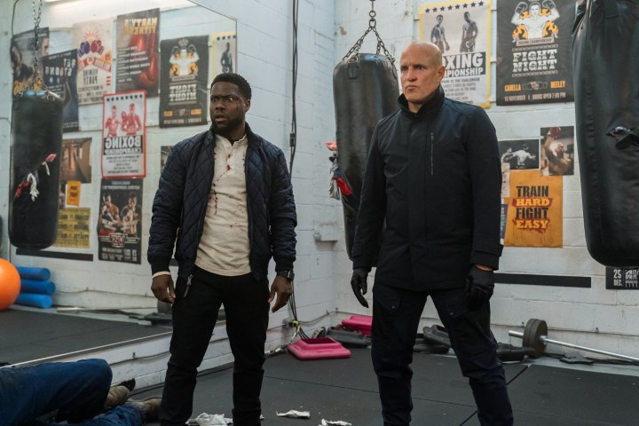 Kevin Hart and Woody Harrelson stand next to each other in The Man from Toronto.
