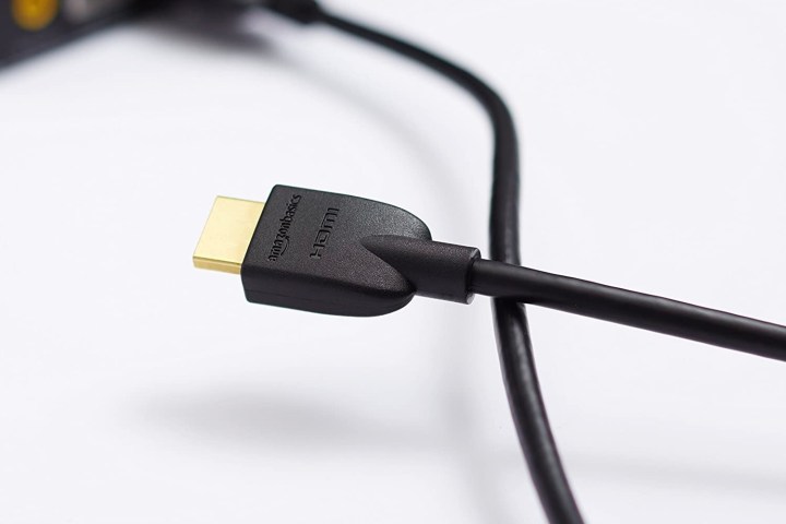 The AmazonBasics HDMI cable being used for a laptop.