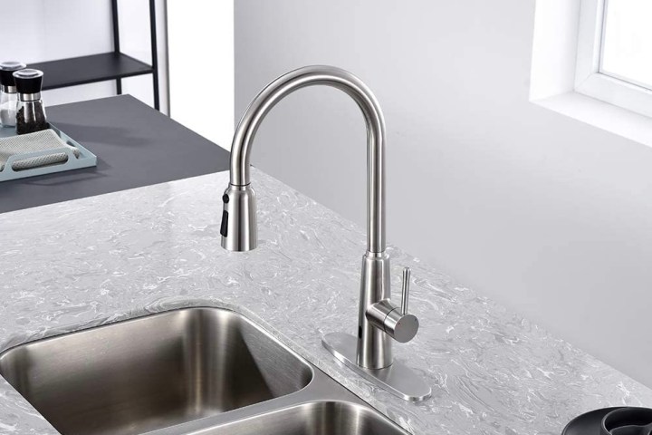 The Owofan Touchless Kitchen Faucet being used for a double bowel sink.