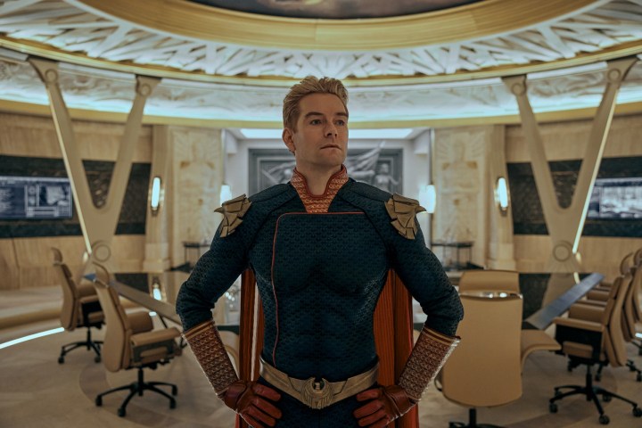 Antony Starr as Homelander stands anxiously in a room.