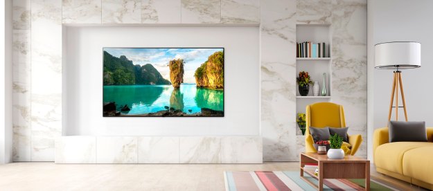 An 83-inch LG C1 OLED TV hangs on a living room wall.