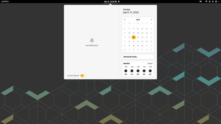 Un écran d'accueil Pop!_OS noir avec un menu blanc et un calendrier ouvert 