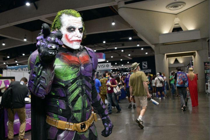 A male cosplayer dressed as Joker and Batman at Comic-Con 2022.