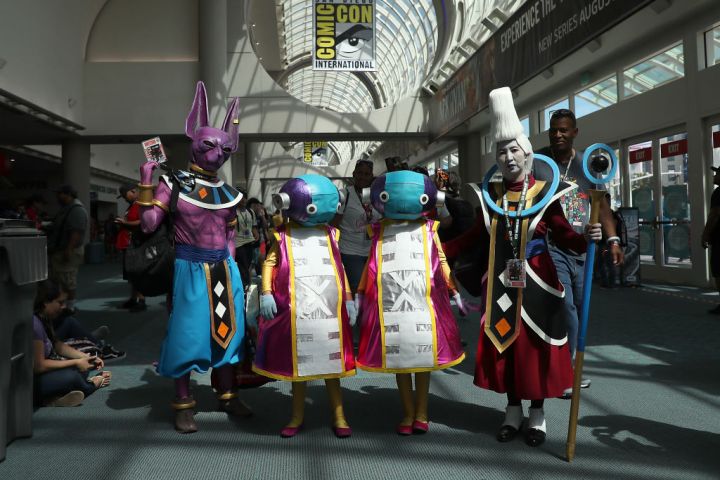 Four cosplayers dressed as Beerus, Zeno, and Whis from Dragon Ball at the 2018 SDCC.