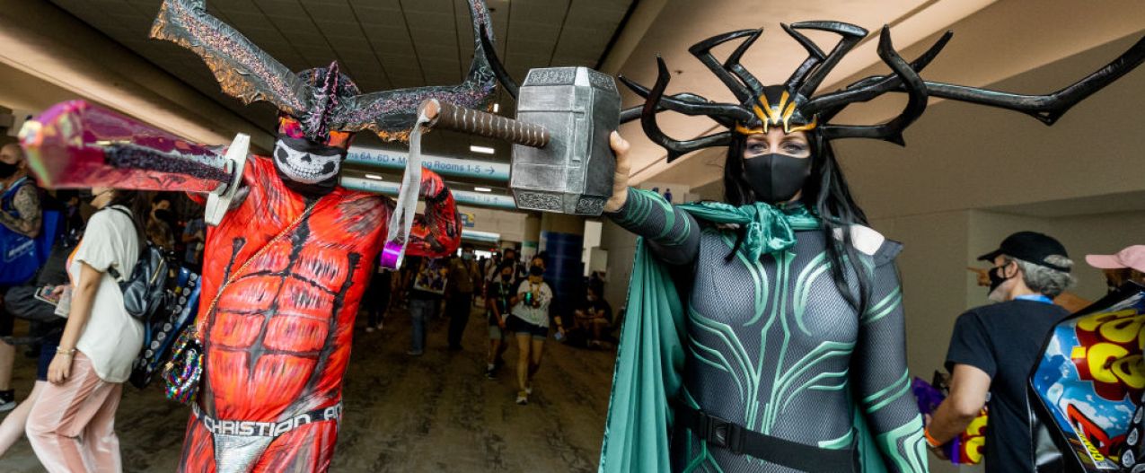 Two cosplayers dressed as Surtur and Hela at Comic-Con 2022.