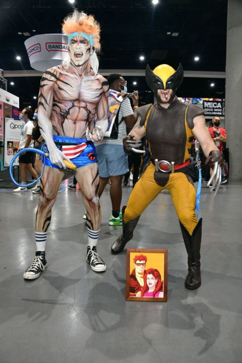 Two cosplayers as Tygra and Wolverine at Comic-Con 2022.