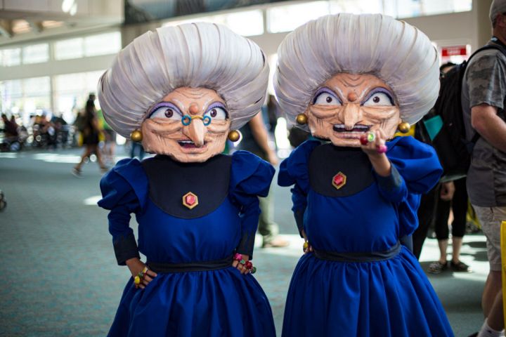 Cosplayers dressed as Zeniba and Yubaba from Spirited Away at the 2019 SDCC.