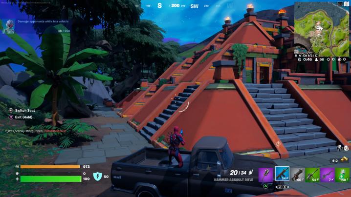 Player shooting out of vehicle at The Temple in Fortnite.
