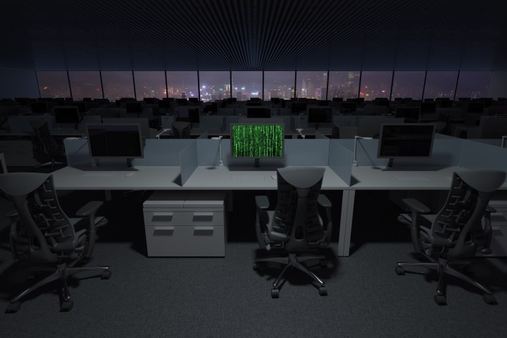 Una representación de una computadora hackeada sentada en una oficina llena de PC.