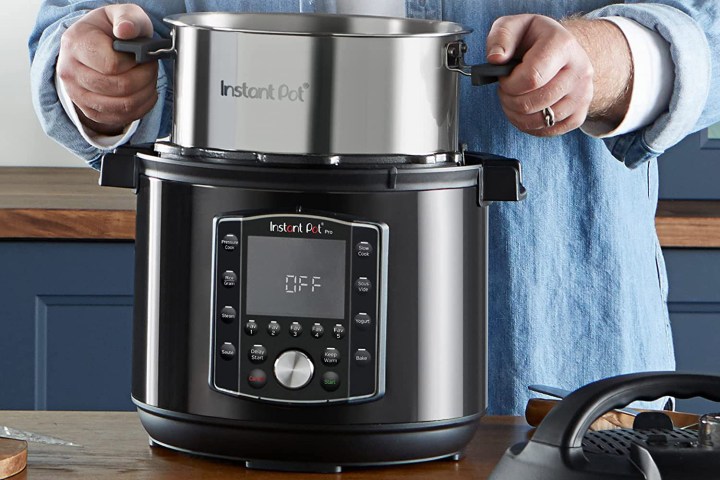 A man prepares to use his Instant Pot Pro 10-in-1.