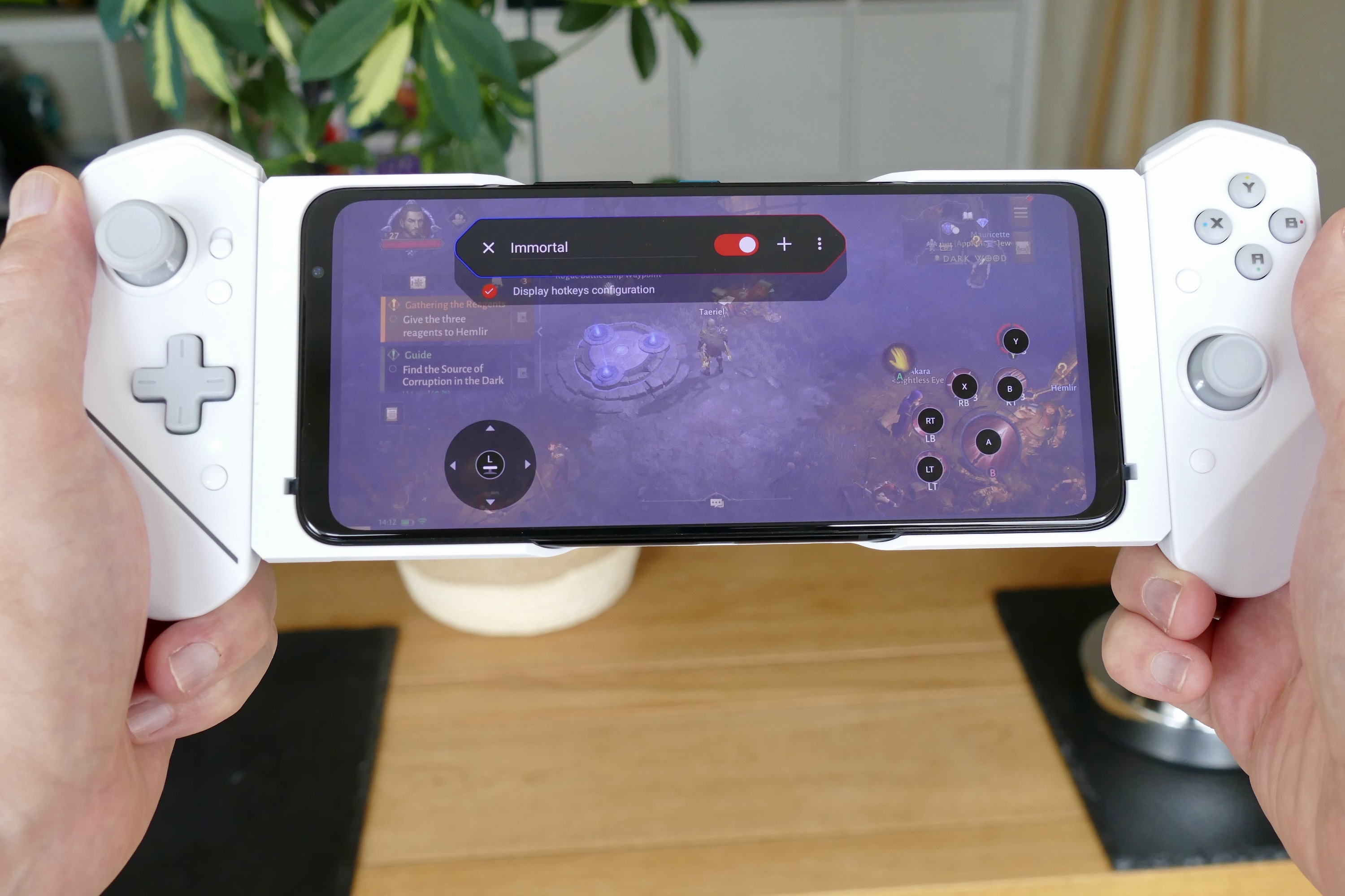 The ROG Phone 6 Pro with the Kunai 3 controller, playing Diablo Immortal.