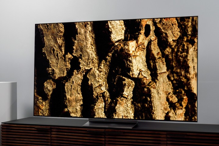 The LG G2 OLED TV displacing a distinctive rock face.