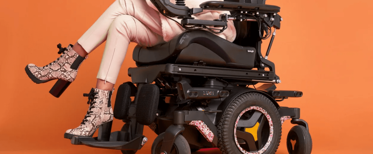 Luci autonomous wheelchair on orange backdrop