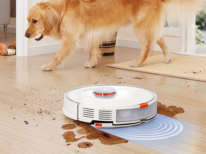 Roborock S7 cleaning a dirty floor with pup nearby successfully.