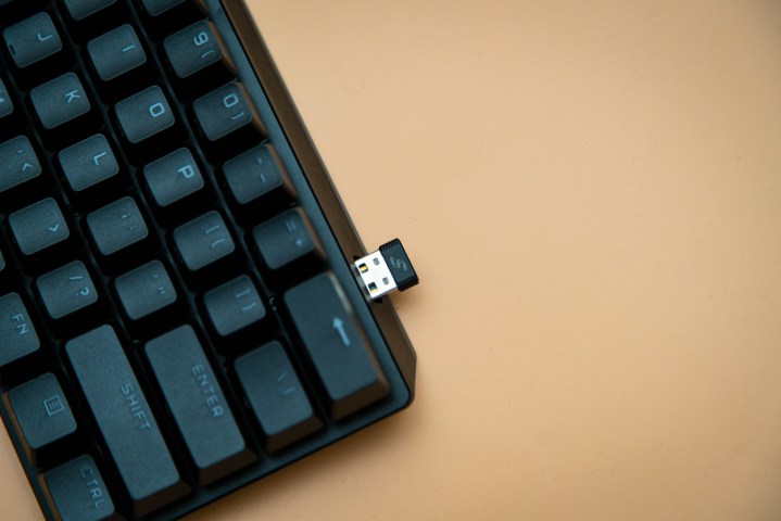 USB dongle hanging out of the Corsair K70 Pro Mini.
