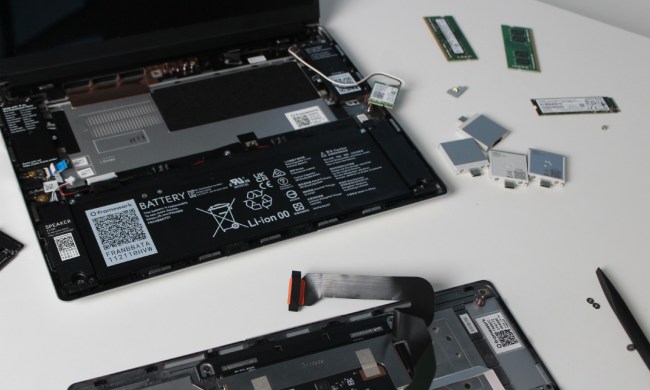Upgrading the Framework Laptop with the components on a table.