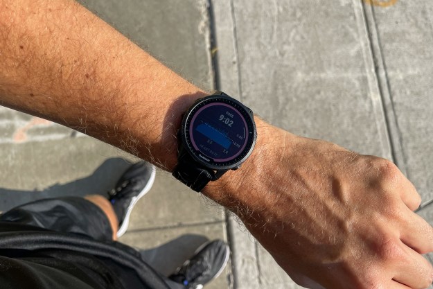 Garmin Forerunner 955 Solar on wrist showing pace information.