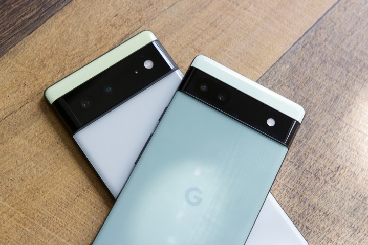 The Google Pixel 6a laying on top of the Google Pixel 6.