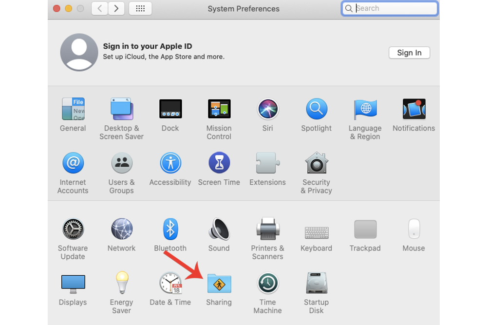 A opção Compartilhamento é destacada no menu Preferências do Sistema em um Mac.