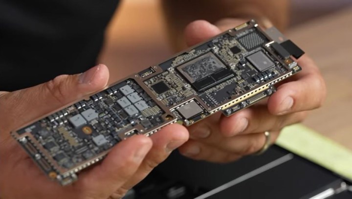 The M2 MacBook Air motherboard is revealed in a YouTube teardown.