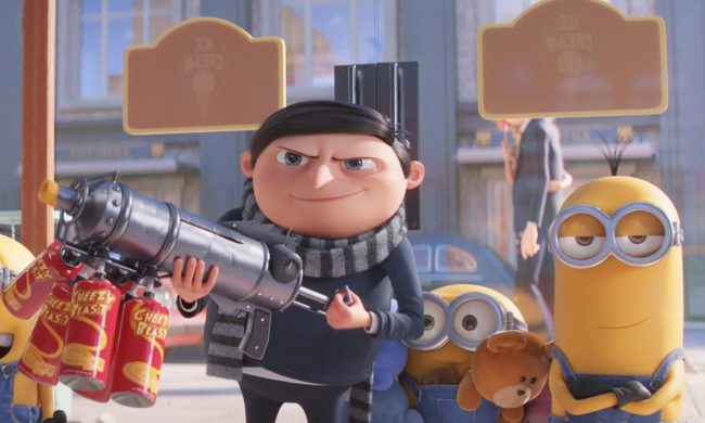 Gru holds a cheese-spraying rifle, surrounded by his Minions.