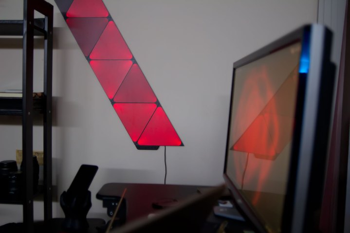 Nanoleaf Shapes light tiles mirroring a video on a screen.
