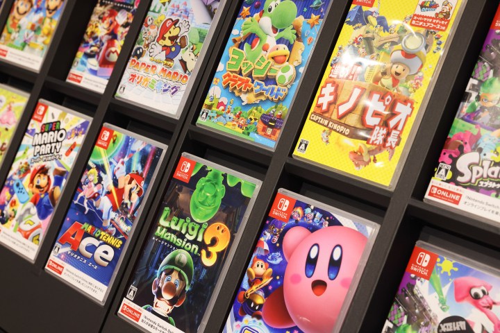 Nintendo Switch video games on display inside Nintendo store.