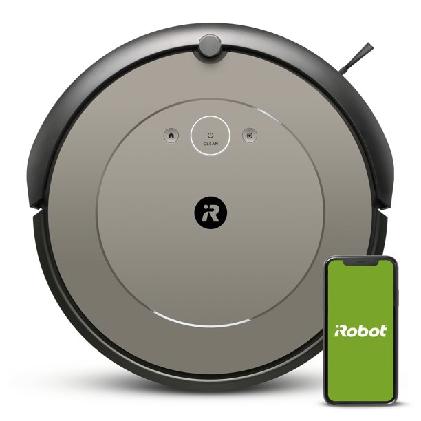 O Roomba i1 fica ao lado de um smartphone em um fundo branco.