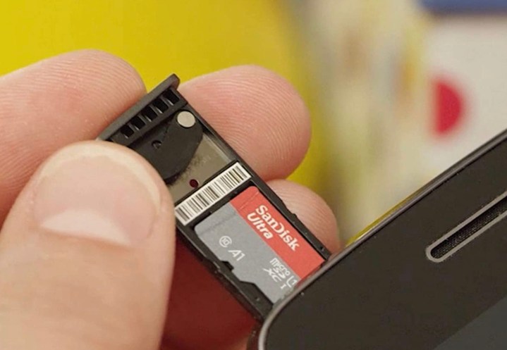 SanDisk 1TB Ultra being put into a phone.
