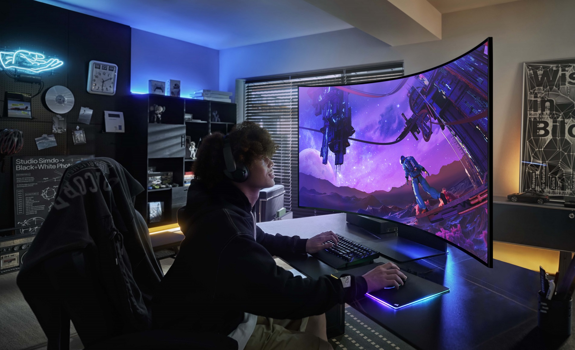 A gamer sits in front of the Samsung Odyssey ARK monitor.