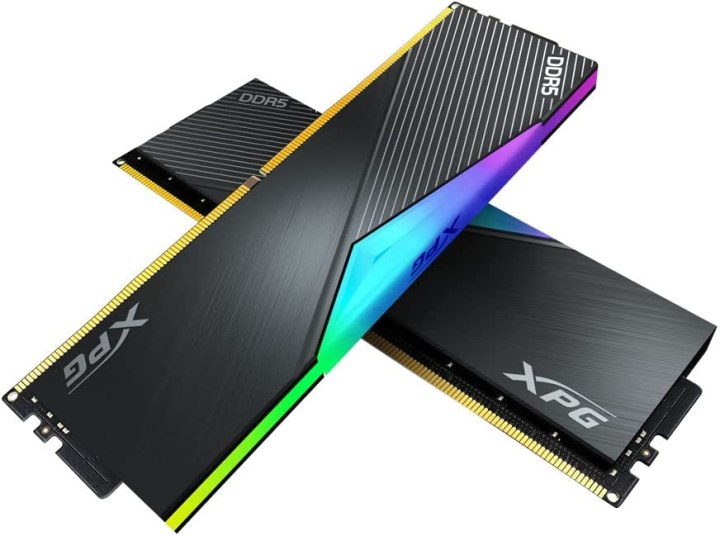 Two XPG Lancer DDR5 RAM sticks with multi-colored RGB lighting along the top and textured black metal frames around the rest