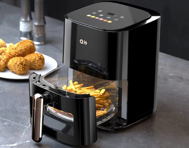 The Aukey Home 3.5 Quart Air Fryer with fries in the basket.