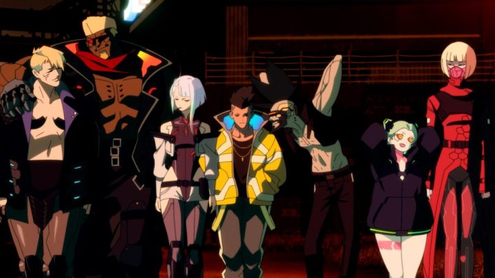The crew in Cyberpunk: Edgerunners standing beside each other in a still from the series.