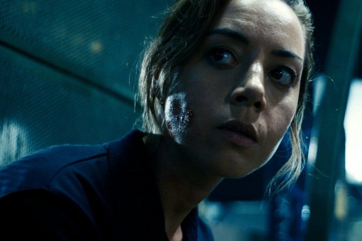 Aubrey Plaza looks behind her in Emily the Criminal.