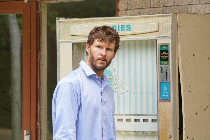 Ryan Kwanten looks out of a vending machine in a scene from Glorious.