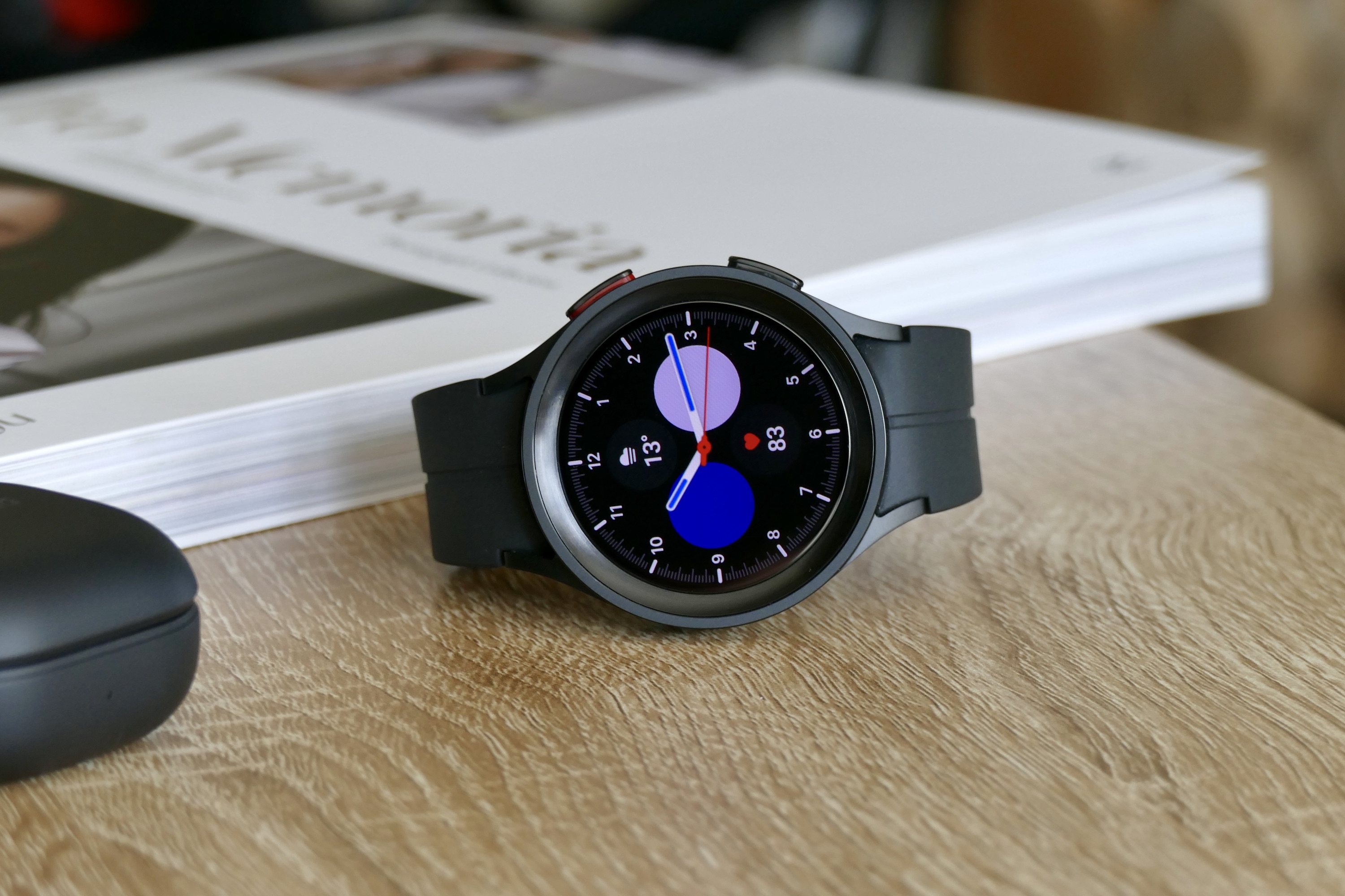 The Galaxy Watch 5 Pro showing a classic watch face.
