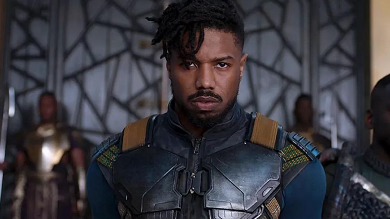 Erik Killmonger standing in the throne room with two guards behind him in Black Panther.