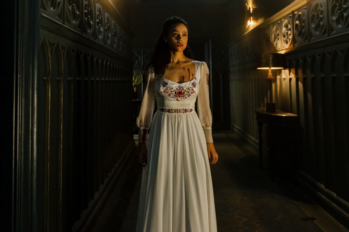 Nathalie Emmanuel wears a bloodied white dress in The Invitation.