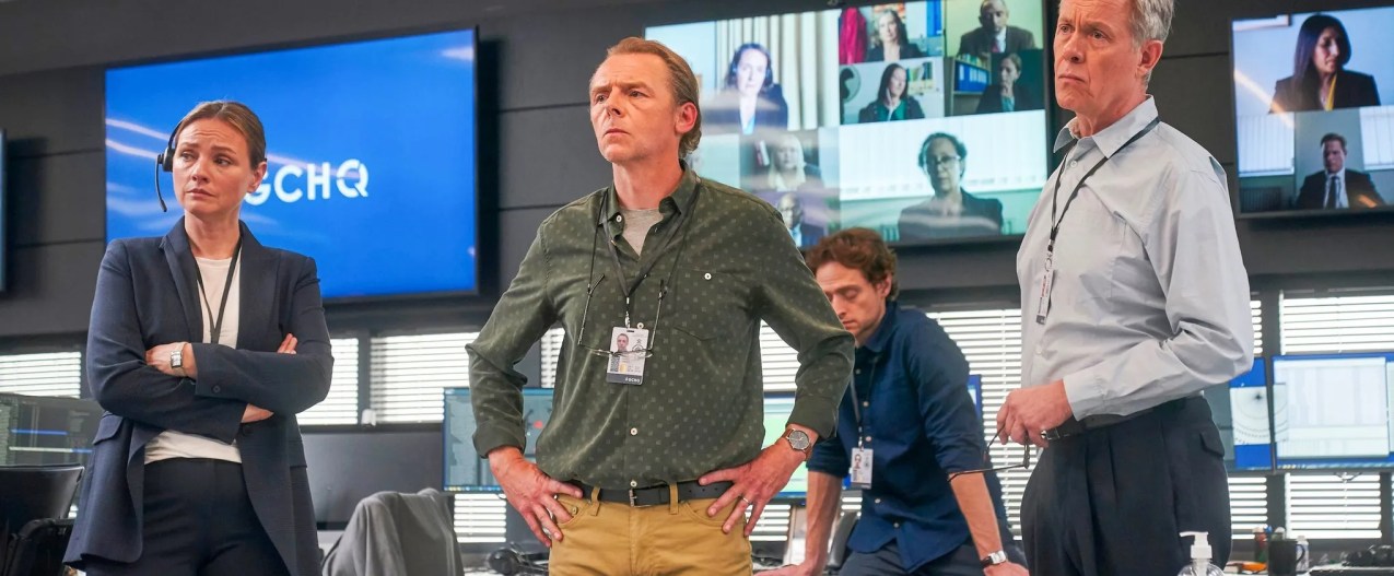 Simon Pegg and Alex Jennings stand in an office together in The Undeclared War.